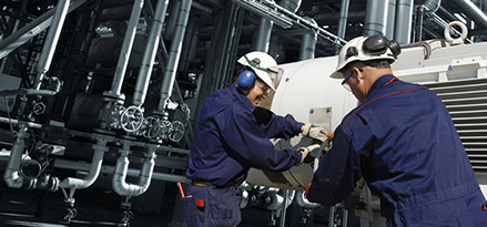 Men working refinery